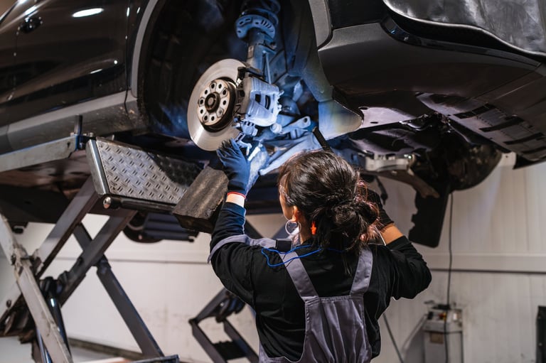 Mechanic on hydraulic lift