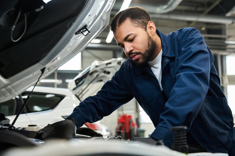 Mechanic working under hood
